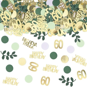 Detail of 60th birthday confetti set with gold glitter letters and green leaf decorations