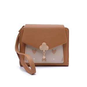 Detail of short PU leather wallet with heart print and cloud-shaped metal buckle