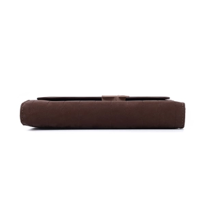 Detail of dark brown long wallet showing fine vertical stitching and metal clasp on the side