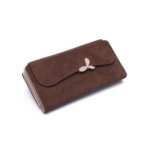 Detail of long brown wallet featuring matte texture and pink leaf metal clasp buckle