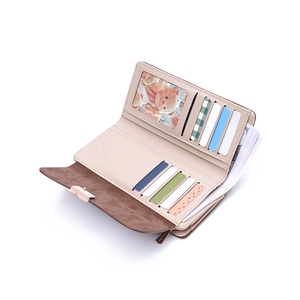 Inside view of women's long wallet showing multiple card slots and a photo window