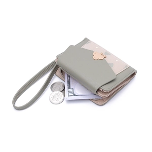 Short bi-fold women's wallet in sage green and pink leather with metal butterfly clasp