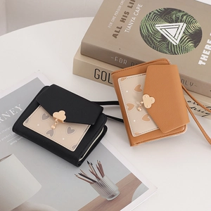 Detailed view of PU leather short wallets with heart print and cloud metal pendant charm