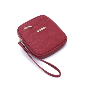 Wine red small zip wallet in saffiano leather with wristlet and gold hardware