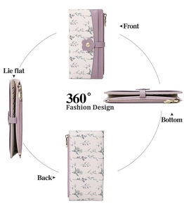 Detailed view of women's purple floral wallet featuring card slots and leaf zipper