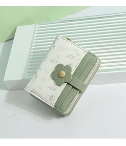 Close-up of PU leather floral wallet showing green card slots and floral metal clasp detail