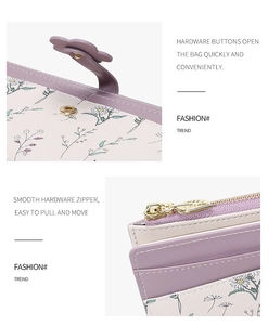 Detail of floral metal buckle and leaf zipper on purple daisy pattern wallet