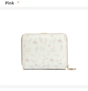 Close-up of white floral PU leather wallet with pink plant pattern and gold zipper