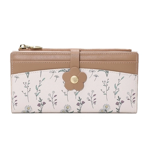 Close-up of long women's wallet featuring floral print leather and golden flower clasp
