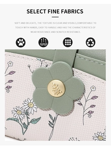 Detail of floral PU leather wallet featuring smooth green flap and golden flower buckle