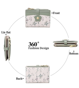 Detail view of small floral PU leather wallet with leaf zipper and snap closure
