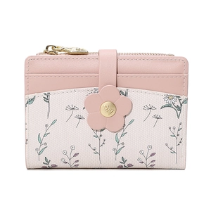 Detail of pink floral PU leather folding wallet featuring a gold flower-shaped buckle