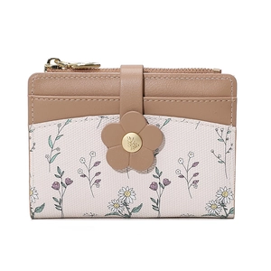Detail of floral clasp and daisy pattern on premium brown and cream leather wallet