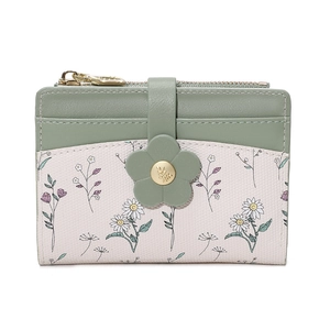 Close-up of floral buckle and daisy print on sage green and cream short leather wallet