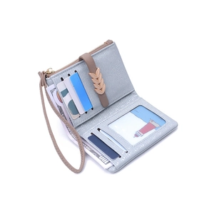 Internal view of floral short wallet featuring card slots and golden leaf buckle detail
