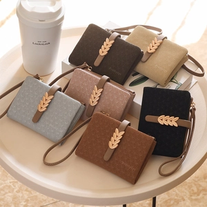 Elegant bifold wallets with gold leaf buckles and wrist straps in six stylish colors