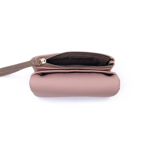 Detail view of pink leather mini wallet showing double compartments and gold zipper