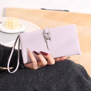 Close-up of lavender PU leather wallet with heart-shaped metal buckle and wrist strap
