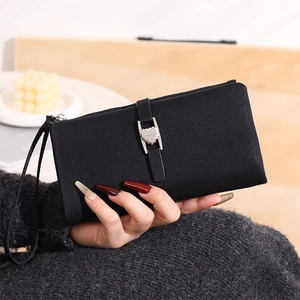 Detail of black Saffiano leather long wallet with silver heart buckle and hand strap