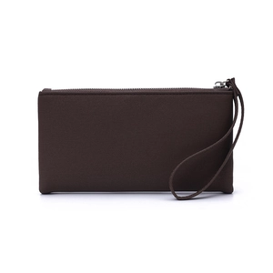 Close-up of brown long wallet showing leather texture, wrist strap, and silver metal zipper