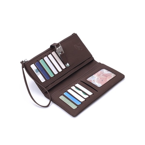 Deep brown women's long tri-fold wallet featuring multiple card slots and wristlet strap