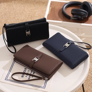 Detailed view of long PU wallets with heart buckles and wrist straps in three colors