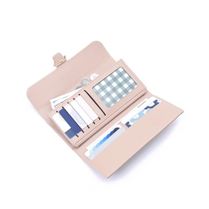 Detail of pink PU leather wallet interior with multiple card slots and cash compartments