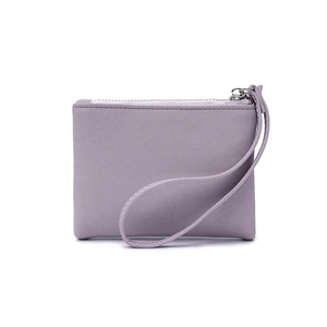 Detail view of lavender faux leather wallet with wristlet strap and silver zipper closure