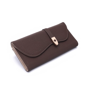 Close-up of brown textured leather long wallet with rose gold floral metal buckle detail