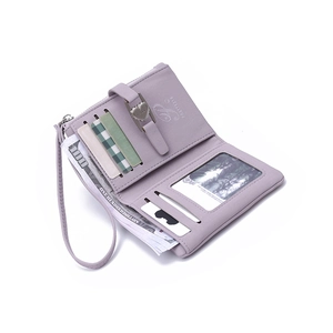 Detail view of purple leather wallet interior with card slots and a clear ID window