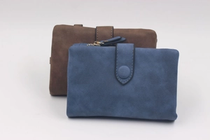 Detail of navy blue and brown frosted leather tri-fold wallets with secure snap closure