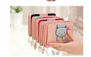 Hand holding five colorful cat-themed PU leather short wallets with cute fish charms