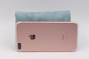 Close-up of the rose gold metal back and dual camera setup of the smartphone