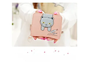 Close-up of pink PU leather coin purse featuring a cute cartoon cat patch and fish print