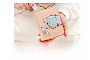 Detail of pink PU leather short wallet featuring cute cat patch and fish embroidery
