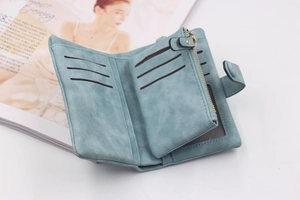 Detail view of tri-fold wallet with multiple card slots and a zipper coin pocket