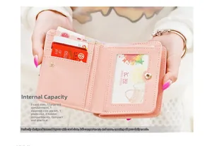 Detail of pink short wallet interior showing card slots, bill pocket and photo holder