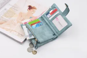 Detailed view of light blue frosted tri-fold wallet with multiple card slots and coin pocket