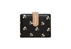 Close-up of black PU leather wallet with quilted floral patterns and Prettyzys snap buckle