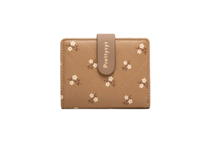 Close-up of brown PU leather folding wallet with white floral print and diamond stitching