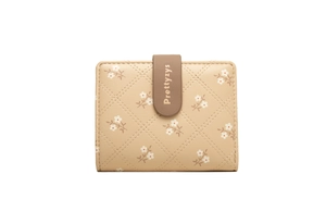 Detail of beige PU leather wallet featuring quilted stitching and floral print