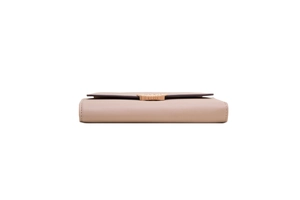 Side view of long pale pink leather wallet featuring fold-over flap and gold buckle