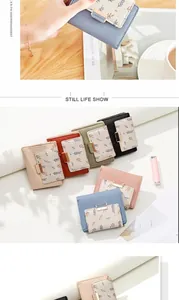 Detail of floral printed PU leather wallet showing various colors and a metallic buckle