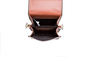 Internal view of brown PU leather phone bag with card slots and golden metal clasp