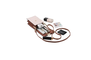 Detailed interior of a pink and brown crossbody phone bag with compartments