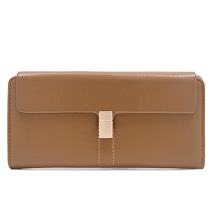 Detail of caramel brown wallet with a gold heart-shaped metal clasp and phoenix engraving