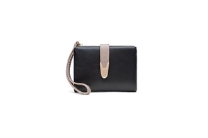 Close-up of black textured leather wallet with pink wrist strap and metal V-buckle detail