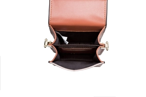 Detail view of the brown PU leather phone bag interior featuring card slots and stitching