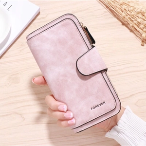 Close-up of pink long PU leather wallet with FOREVER embossing and snap closure design
