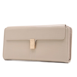 Detailed macro view of cream faux crocodile texture and gold heart clasp on long wallet